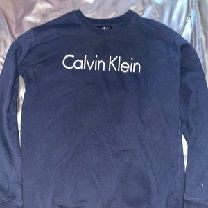A plain black Calvin Klein long sleeve crew neck.